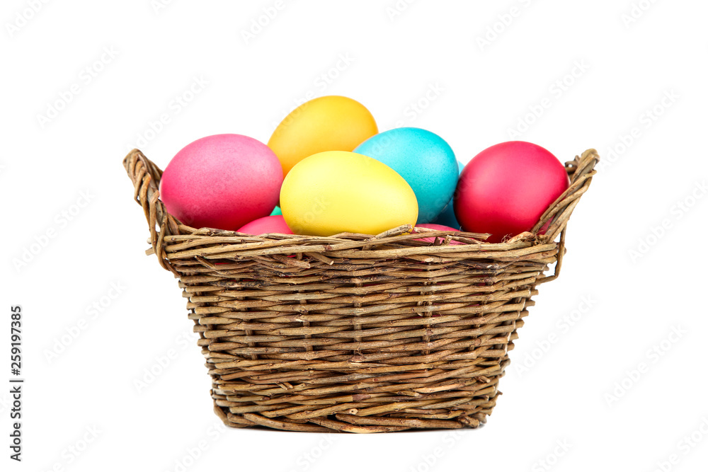 Easter eggs in basket isolated on white background Easter eggs in basket isolated on white background