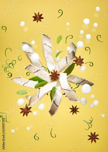 Haddock with spices against yellow background