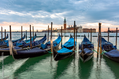 Gondolas moored in Piazza San Marco with San Giorgio Maggiore church in the background, Italy