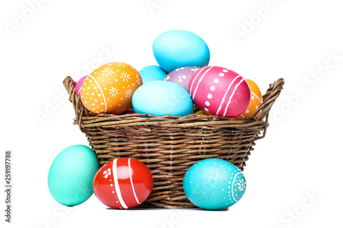 Easter eggs in basket isolated on white background