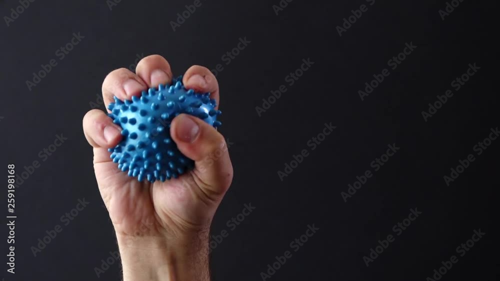 hand with blue stress ball hand with blue stress ball
