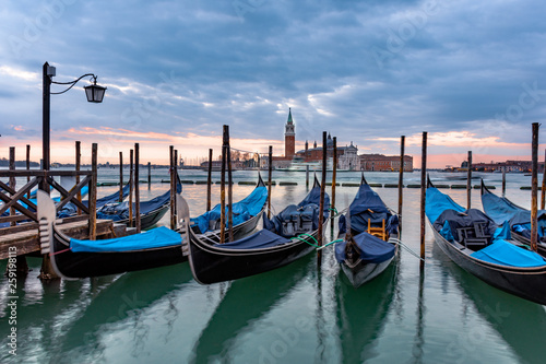 Gondolas moored in Piazza San Marco with San Giorgio Maggiore church in the background, Venice, Italy