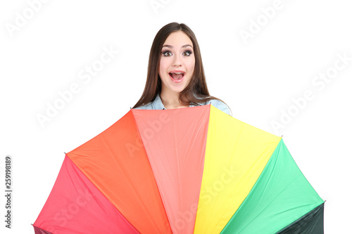 Young girl with colorful umbrella on white background