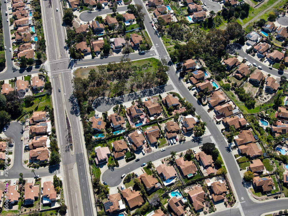 Aerial view suburban neighborhood with identical wealthy villas next to ...
