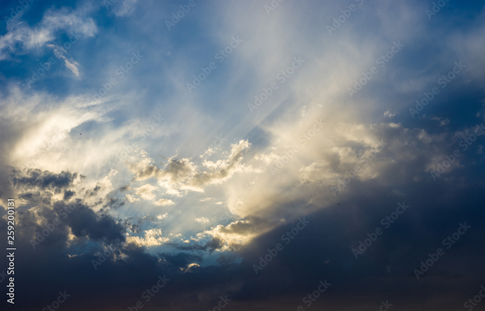 Obraz premium Landscape with dramatic light - beautiful golden sunset with saturated sky and clouds.