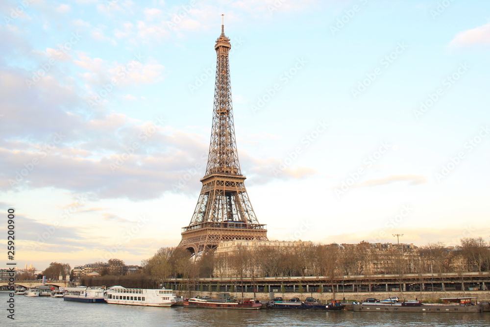 Fototapeta premium Beautiful sky over the Eiffel tower and river seine, Paris capital and the most populous city of France
