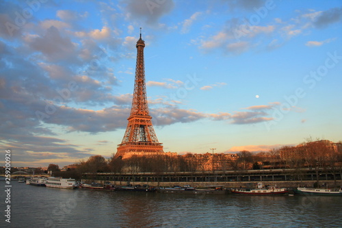 Beautiful sky over the Eiffel tower and river seine, Paris capital and the most populous city of France © Picturereflex
