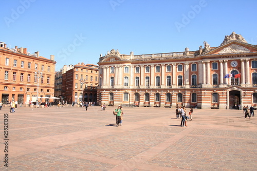 Toulouse central square and the emblematic and majestic Capitole, a town hall and theatre in the heart of the pink city, the major city of Southwestern France and historical capital of Languedoc
