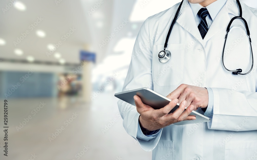 Close-up Doctor at hospital working with tablet pc Close-up Doctor at hospital working with tablet pc