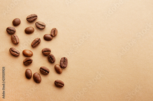 Scattered coffee beans frame design on copy space background.