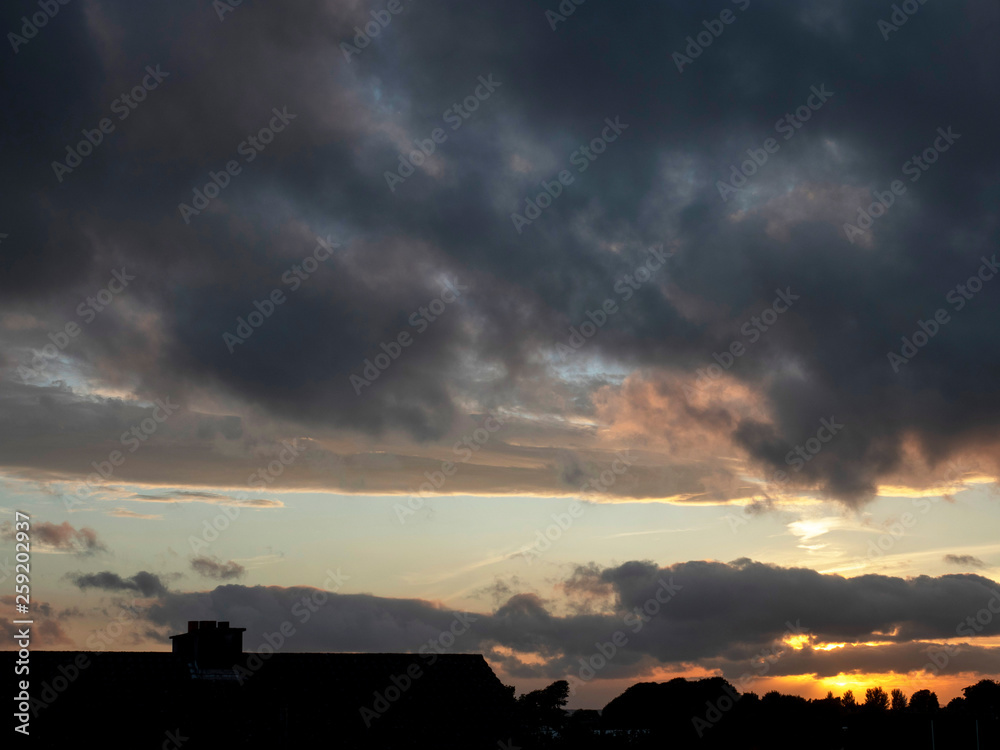 Sunset time, Silhouette of a roof of a house. Concept town life,