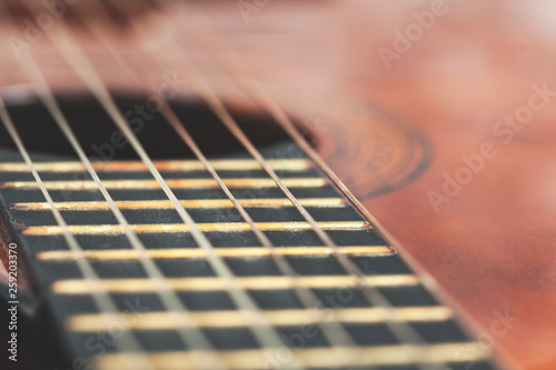 brown guitar on desk