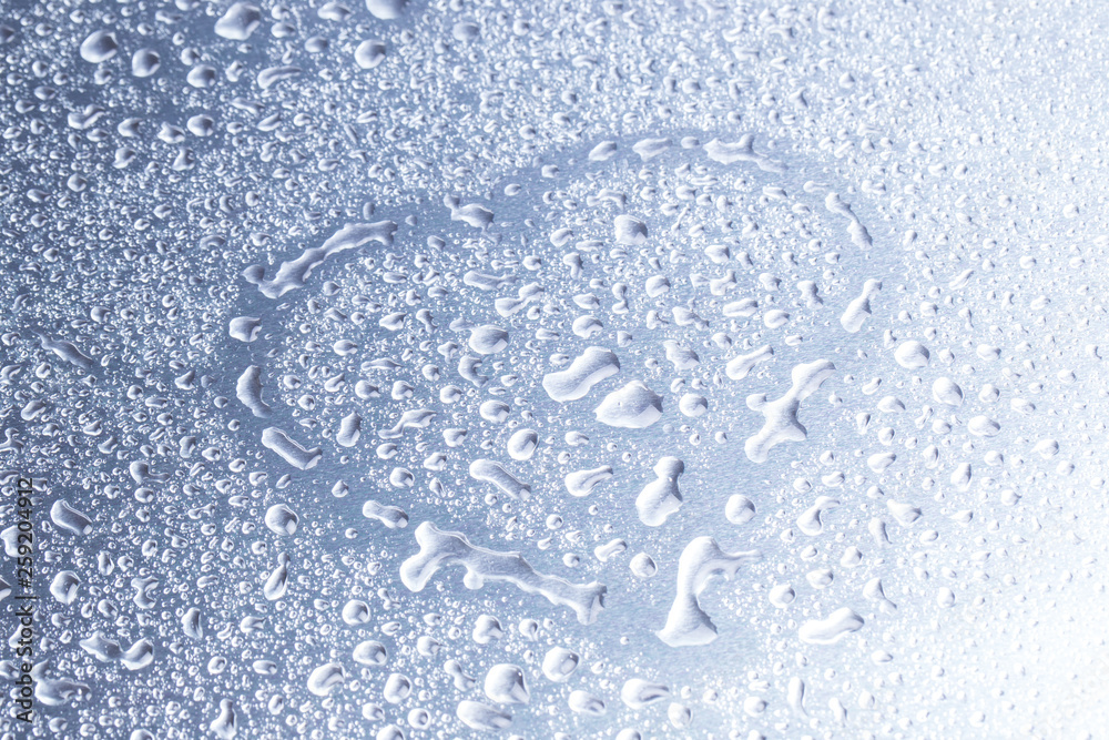 Drops of water on a gray background closeup Drops of water on a gray background closeup