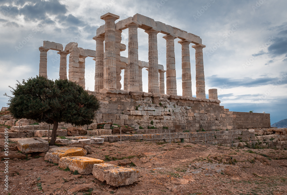 Greek temple olive tree orange stones clouds