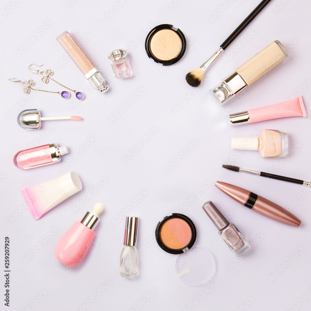 Square image of cosmetics for social media with empty place for text. Woman make up cosmetics on purple. Copy space. Gold and purple decorative cosmetic: highlighter, concealer, rouge, eye shadows etc Square image of cosmetics for social media with empty place for text. Woman make up cosmetics on purple. Copy space. Gold and purple decorative cosmetic: highlighter, concealer, rouge, eye shadows etc