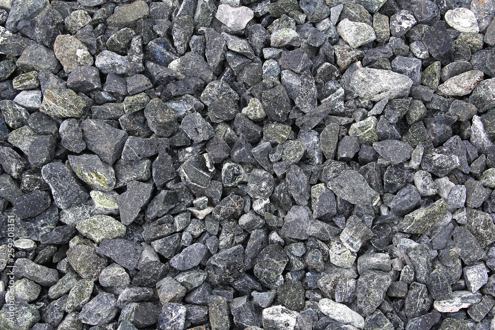 Background of stone rubble. Stone rubble as a building material.