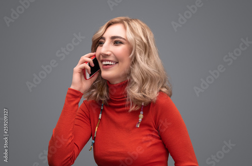 Laughing lady speaking on phone