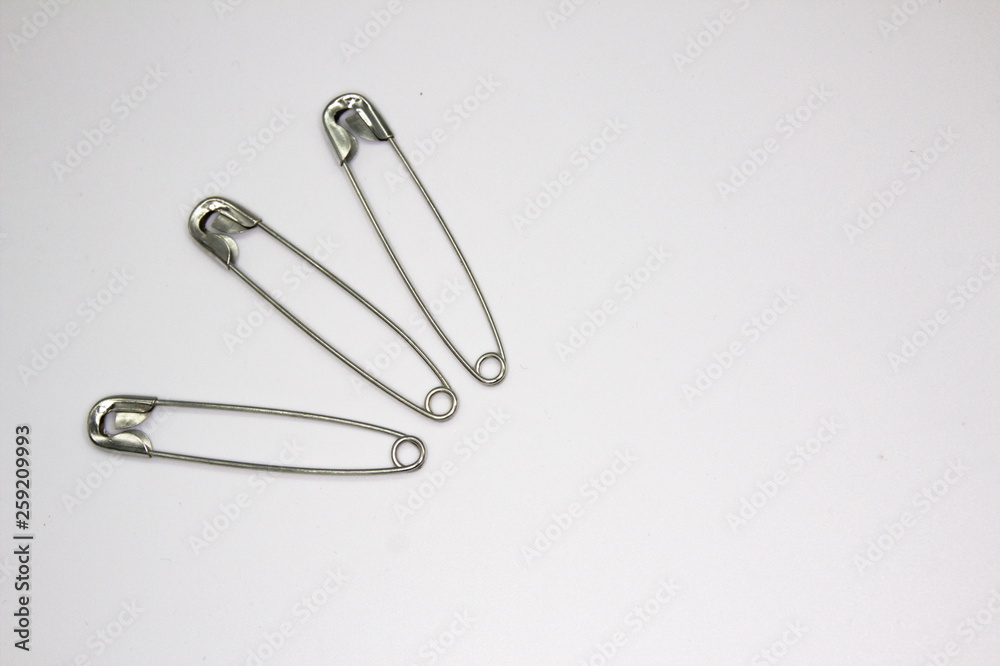 sewing safety pin isolated on a white background sewing safety pin isolated on a white background