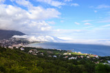 Beautiful nature phenomenon. Thick descent clouds descend from the mountains directly into the Black Sea