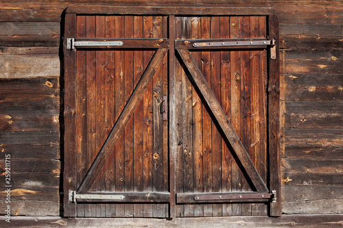 Grunge wooden barn door. Rustic vintage desk construction background. photo