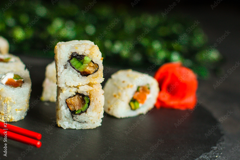 Sushi rolls different taste, rainbow color (fresh seafood) serving. Food background. Top view Sushi rolls different taste, rainbow color (fresh seafood) serving. Food background. Top view