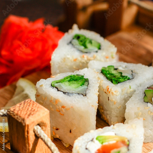 Sushi rolls different taste, rainbow color (fresh seafood) serving. Food background. Top view
