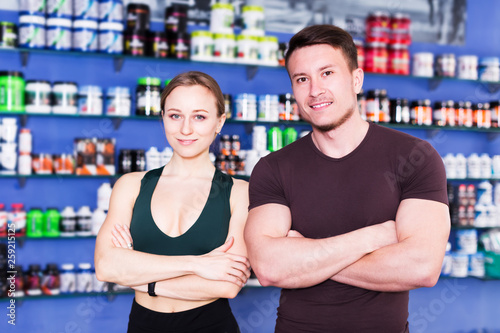 Athletic people in sports nutritional shop