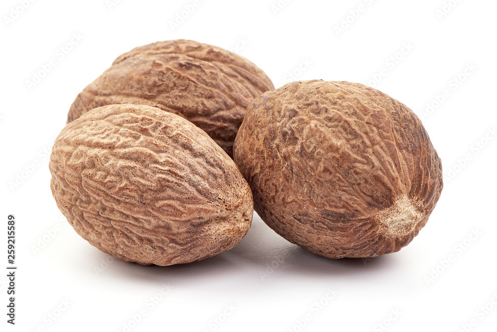 Fresh Nutmeg. Whole nuts, close-up, isolated on white background Fresh Nutmeg. Whole nuts, close-up, isolated on white background