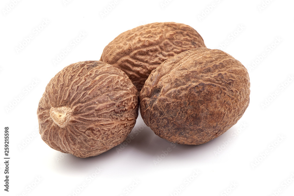 Fresh Nutmeg. Whole nuts, close-up, isolated on white background Fresh Nutmeg. Whole nuts, close-up, isolated on white background