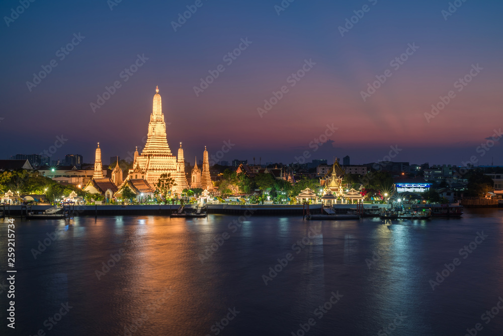 Night photo illuminated old Wat Arun Ratchawararam Ratchawaramahawihan or Wat Arun 