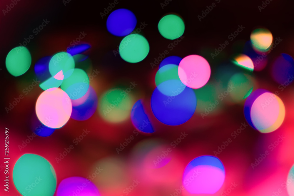 Abstract background of neon lights. The lights are out of focus.