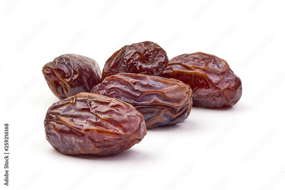 Fresh Medjool dry Dates, close-up, isolated on white background Fresh Medjool dry Dates, close-up, isolated on white background
