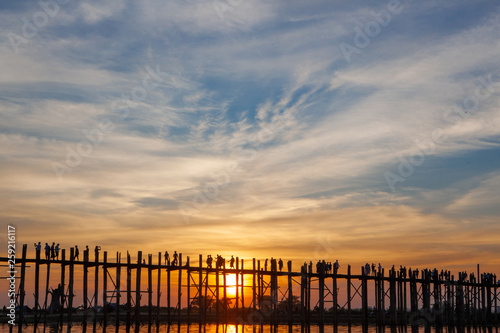 Sunset over U Bein Wooden bridge with locals  and tourists  silhouettes  Mandalay  Myanmar