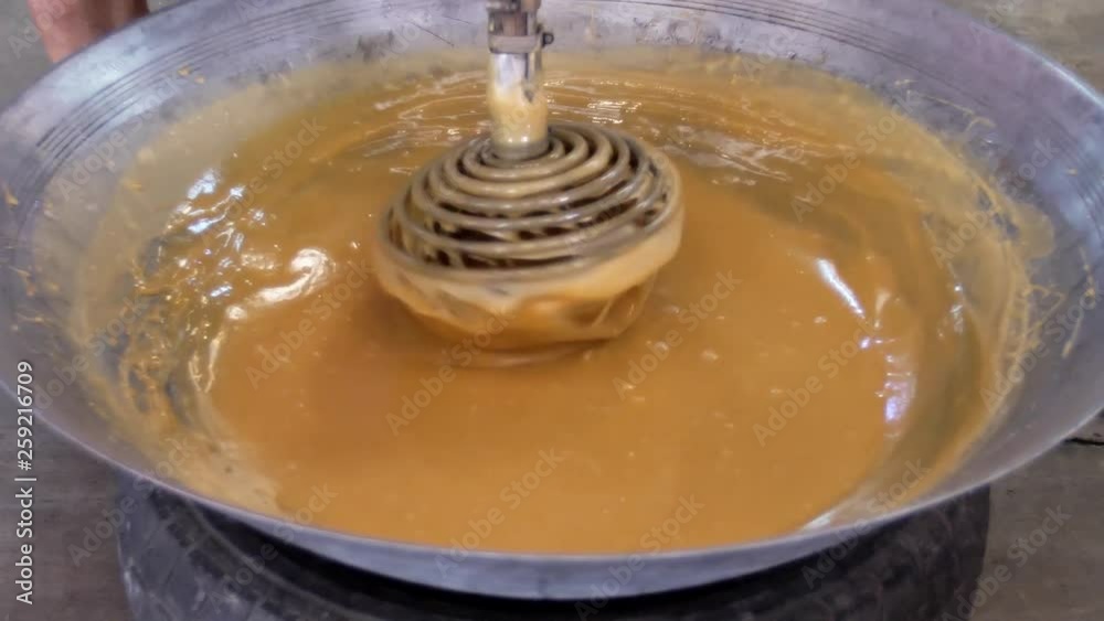 Coconut sugar Production. real coconut sugar make from Nectar of coconut flower to stir in hot process until condense . Left to cool until it becomes solid yellow surface .Coconut sugar i Coconut sugar Production. real coconut sugar make from Nectar of coconut flower to stir in hot process until condense . Left to cool until it becomes solid yellow surface .Coconut sugar i