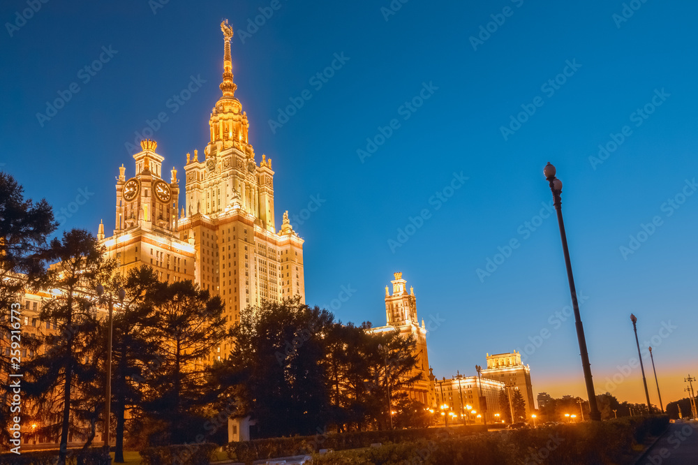 Stalin's architecture at night in Moscow on a background of blue sky