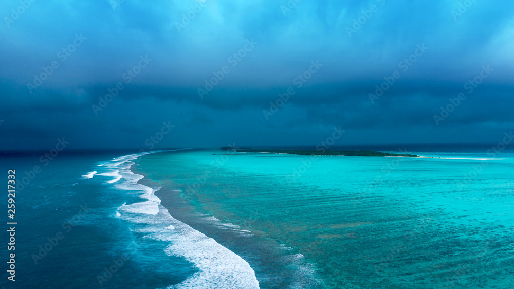 Obraz premium Beautiful aerial view of Maldives and tropical beach . Travel and vacation concept