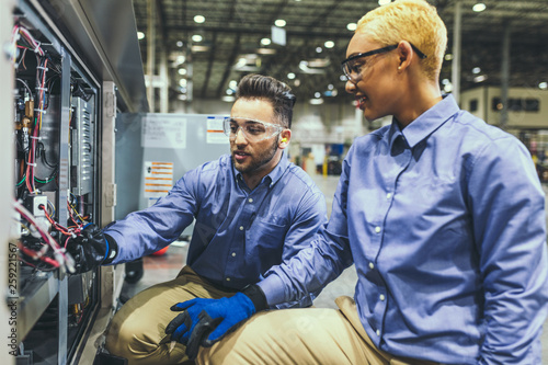 Service technicians inspecting equipment