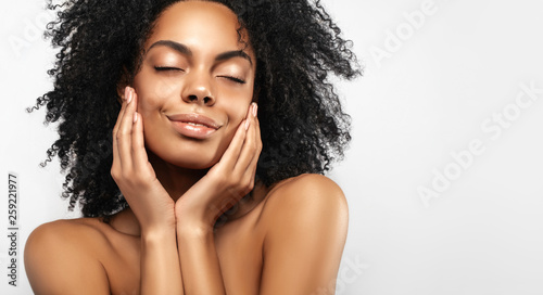 African American skincare models with perfect skin and curly hair. Beauty spa treatment concept. Web banner with copy space