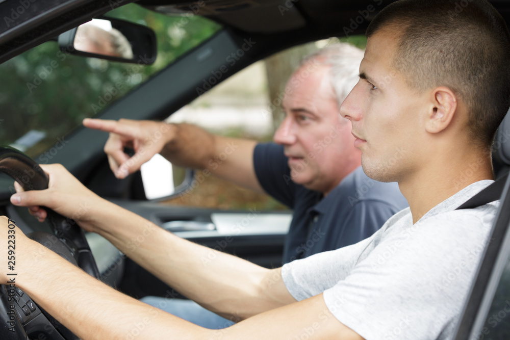 father and son in a car father and son in a car