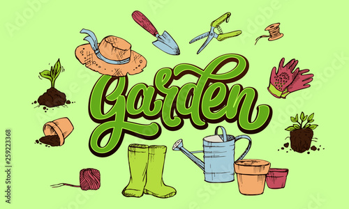 Lettering Garden word in fresh greenery surrounded by gardener's attributes