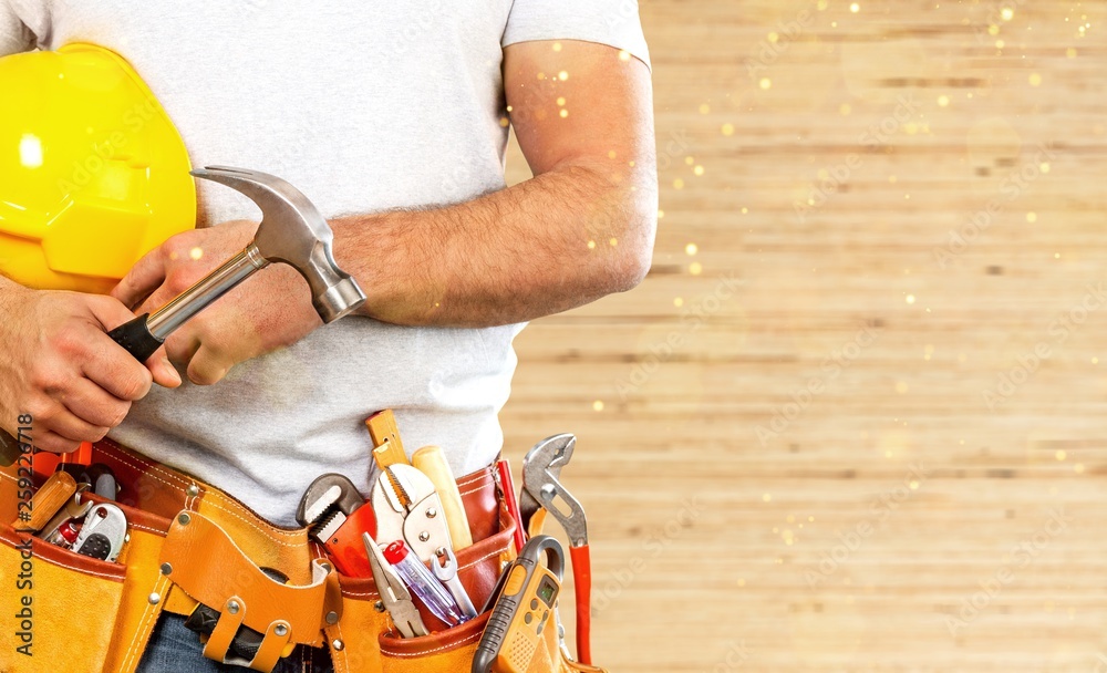 Worker with a tool belt. Isolated over Worker with a tool belt. Isolated over