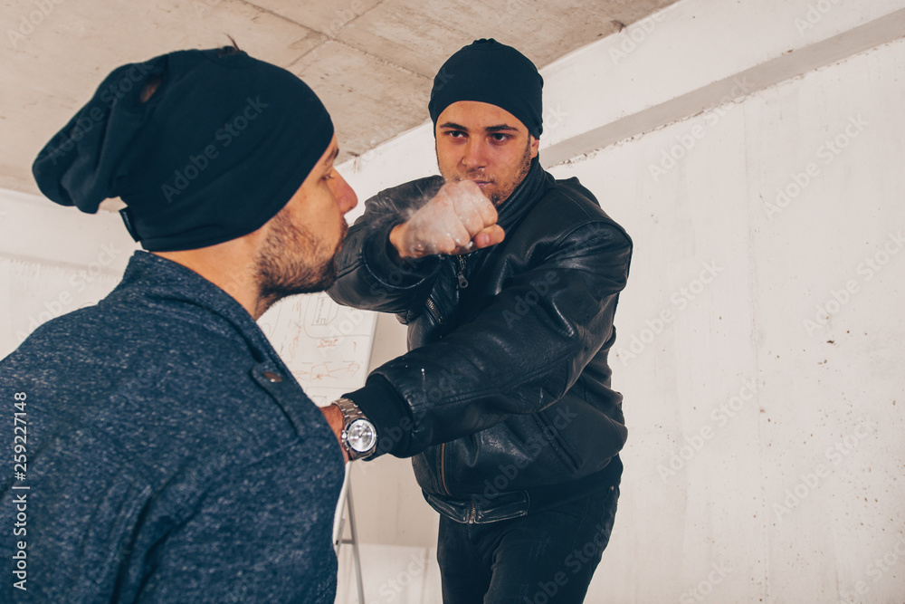 Thief being punched with fist in his face Thief being punched with fist in his face