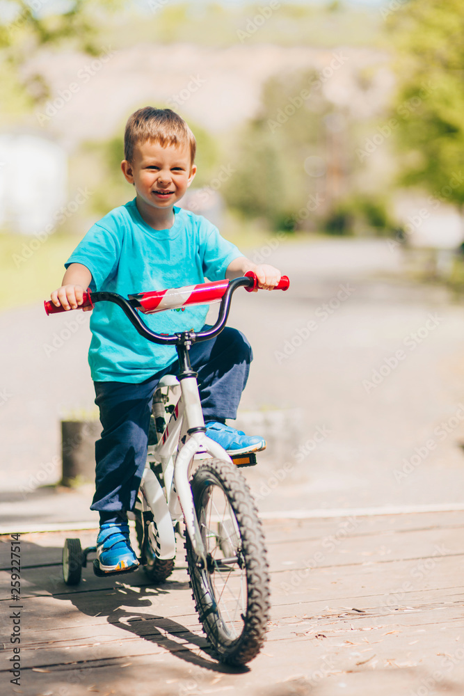 Young child driving bike in nature Young child driving bike in nature
