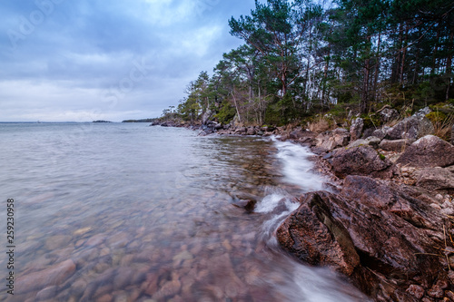 waves flow into a rocky beach