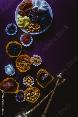 Eid Mubarak. Different iftar sweets. Celebrating Eid Al Adha. Islamic traditional holiday. Eid al-Fitr. Holly month Ramadan. Middle Eastern religious holiday. Dried date fruit. Flat lay, top view.