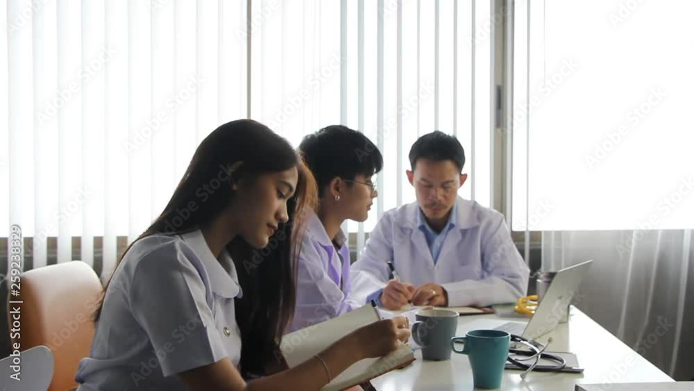 The doctor team consulting about teatment plan together The doctor team consulting about teatment plan together