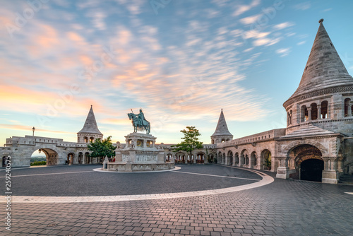Fisherman' Bastion and the Square of Holy Trinity in Budapest , Hungary early in the morning at sunrise