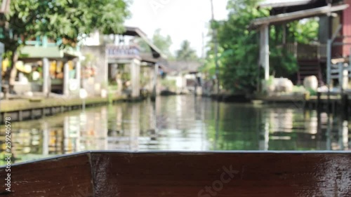 View of long tail boat, on the Damnoen Saduak popular floating market river is about 100 km southwest of Bangkok in RATCHABURI province , Floating