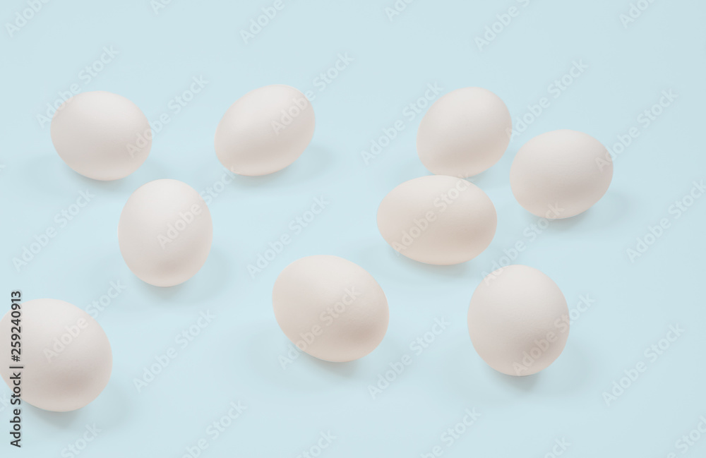 White egg. Raw eggs on pastel blue background. White egg. Raw eggs on pastel blue background.