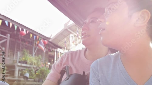 Happy asian mother and son in Floating market is famous in Thailand, Damnoen Saduak popular floating market is about 100 km southwest of Bangkok in RATCHABURI province photo